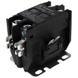 Black electrical contactor with multiple flat terminals and mounting feet