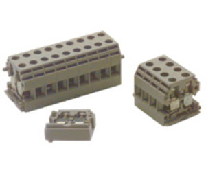Set of beige modular connector blocks: one large rectangular block with multiple round holes, one smaller block, and a flat insert.