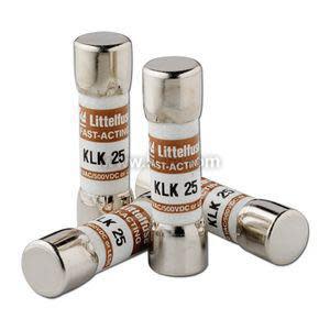 Four small cylindrical electrical fuses labeled KLK 25 standing upright and lying down.