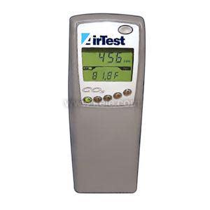 A grey handheld device featuring a rectangular display showing numbers and several small buttons below.