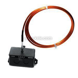 Small black electrical enclosure with thin probe and long coiled copper capillary tube attached