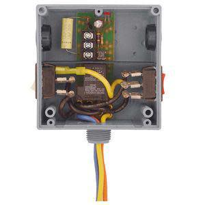 View of an open grey electrical junction box revealing a small circuit board, terminals, and colored wires exiting from the bottom.