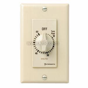 A cream colored timer switch with a rotary knob marked from zero to sixty minutes and an off label above.
