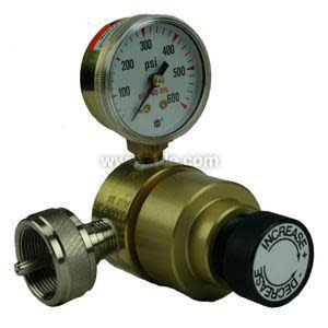 Brass regulator with pressure gauge and black knob labeled Increase/Decrease