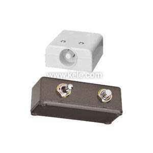 Two separate sensor enclosures: one white plastic case with a round opening and a dark box with two metal studs