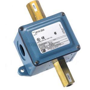 Blue rectangular housing with two horizontal brass rods passing through and electrical conduit fitting.