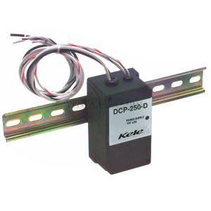 Compact grey power supply with green terminal block and red LED on top.