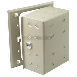 Beige metal guard with perforations and lock for covering a thermostat