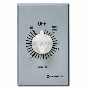 Close-up of a silver wall plate timer with a white knob, black minute markings around, and Off at the top.