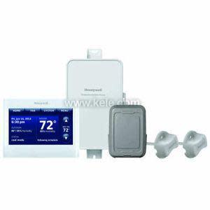 Touchscreen thermostat display reading 72°, with a white control box, a grey rectangular sensor and two clamp-on sensors.