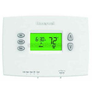 A rectangular white programmable thermostat with a green illuminated screen reading 72 degrees and 6:30, featuring set, hold and run buttons on the left, up and down arrow buttons on the right, and sliding switches for heating and fan modes along the bottom.