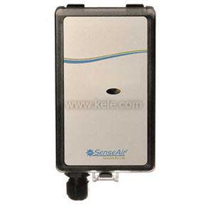 A rectangular sensor device with a beige face featuring a small oval hole and wavy line graphic, encased in a black frame with a cable gland at the bottom.