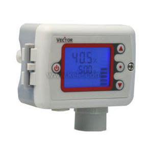 Compact grey wall‑mount transmitter with blue backlit screen showing readings and arrow buttons on the side