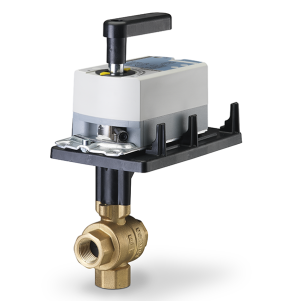 Golden three-port valve with a square white box and a black handle mounted on top.