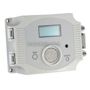 Grey rectangular gas sensor with small LCD screen, round speaker-like vent and test/status buttons