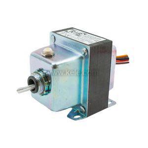 Small metallic transformer with mounting flanges and multicolored wire leads.