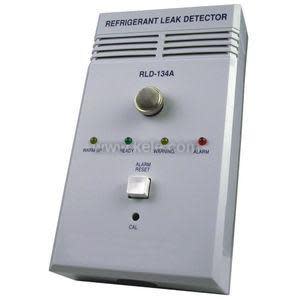 Small rectangular device with colored LED lights and printed refrigerant label.