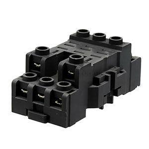 Black plastic connector block featuring multiple holes and slots for electrical terminal wiring