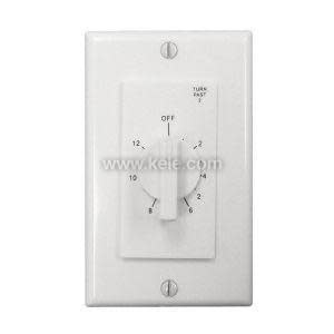 Circular black timer with numbers around the face and a central knob