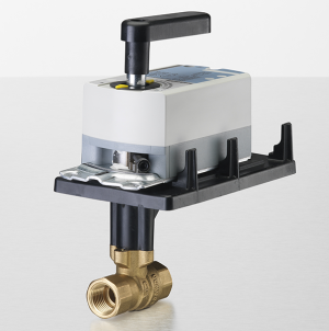Short gold valve with a white rectangular actuator and a small black lever on top.
