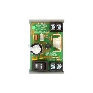 Green circuit board with a black on/off switch, large capacitor, adjustable knob and multiple terminals