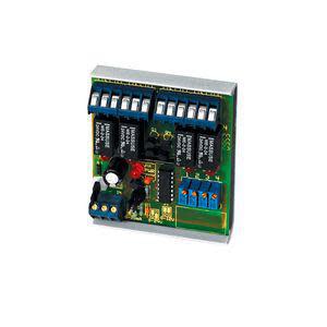 Small square electronic board featuring rows of tiny white switches and blue connector blocks.