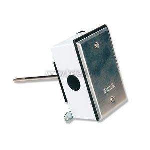A rectangular sensor transmitter mounted on a wall box, with a polished faceplate and a metal rod extending sideways