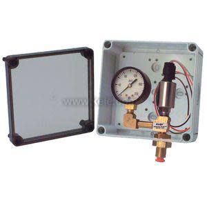 Grey box with round pressure gauge, small switch and protruding conduit connectors.