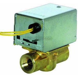 A small brass valve body supports a square metal housing from which a yellow electrical wire emerges; the valve has a threaded port.