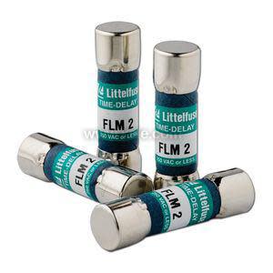 Group of four small cylindrical fuses with metal ends and teal bands marked 'FLM 2'
