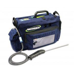 Blue soft carrying case containing a handheld gas analyzer kit with a handle and a long probe attached by a cord.