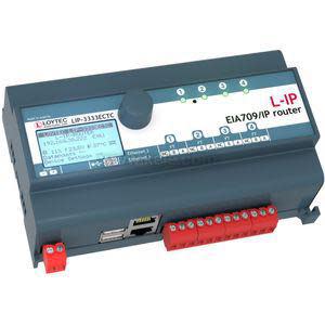 Compact grey network module with LCD screen, buttons and multiple communication ports