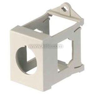 Open beige plastic frame with a round hole on one side and a small triangular tab on top, used as a button housing