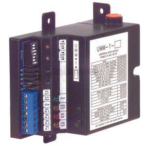 Circuit board with DIP switch bank, labels and green terminal connectors.