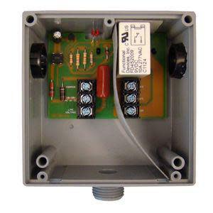 Open gray relay box showing circuit board, terminal strips and conduit fitting