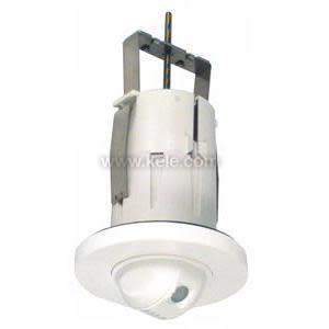 White cylindrical ceiling sensor with round domed lens at bottom and metal mounting brackets on top.