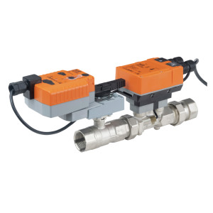 Long metal valve with two orange actuators connected by black cables mounted on a stainless body with threaded ends