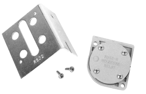 Black‑and‑white image showing a metal L‑shaped mounting bracket with multiple holes and an accompanying circular relay module labeled 'selector relay,' with two small screws placed between them.