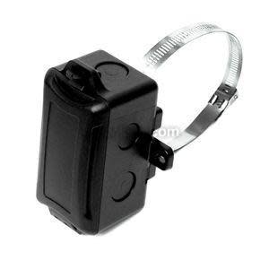Black sensor housing with strap bracket for pipe mounting and threaded opening for probe