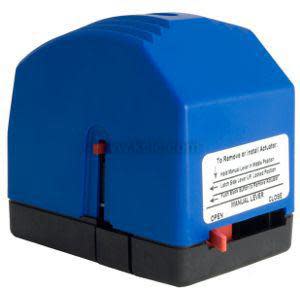 Blue plastic actuator housing on a black base with a red manual lever and printed instructions.