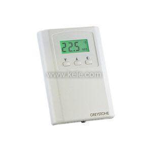 White thermostat-like device with a green screen and four arrow buttons arranged in a diamond shape.