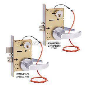 image showing two mortise door lock assemblies with metal lever handles and visible internal mechanisms, each with red cable loops and labelled with various model numbers