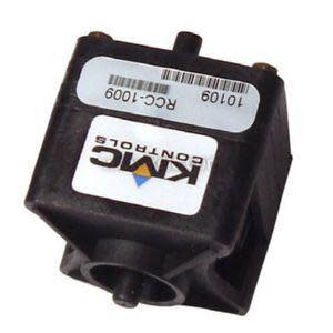 Black square coil with round hole in the center and a label sticker