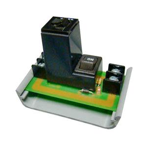 Small circuit board with black relay, on/off button and terminal blocks