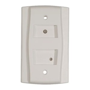 White rectangular wall plate with two recessed sections; the upper has a small LED and the lower a tiny test opening, with two mounting holes