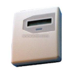 An off-white plastic box with a narrow digital window at the top center.