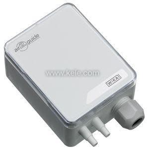 A light grey box‑shaped pressure sensor labeled Air2Guide, showing two small hose connectors and a grey cable fitting on one end