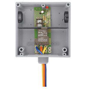 Small board with potentiometer, LED, and various components on a metal mounting plate
