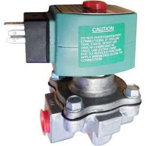 Industrial solenoid valve featuring a grey metallic body and a green rectangular actuator with a red manual override and caution instructions printed on the side.