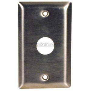 Rectangular brushed stainless plate with a large circular opening in the center and screw holes at top and bottom.